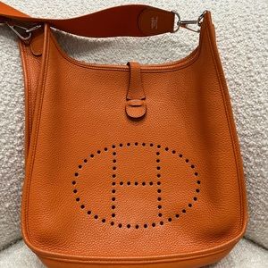 Authentic Hermes Evelyn PM bag. Classic Hermes orange color.